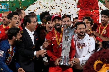 Islamabad United' players and officials celebrate with trophy after winning the final of Pakistan Super League T20 cricket match against Multan Sultans, in Karachi, Pakistan, Monday March 18, 2024.  (AP Photo / Fareed Khan)