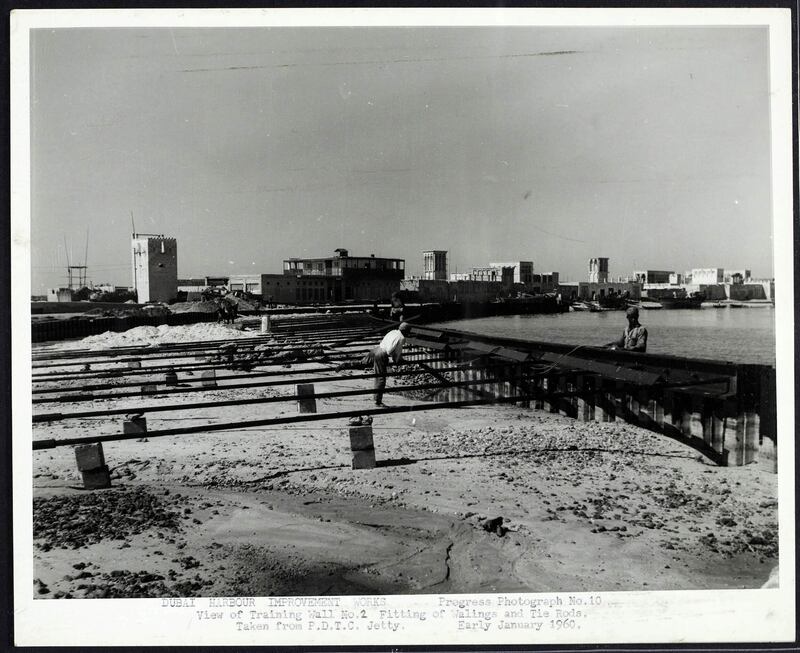 He also was impressed by the merchant houses and their wind towers that once lined the Creek. They can be seen here in the 1960s in the background. Photo: Arabian Gulf Digital Archives