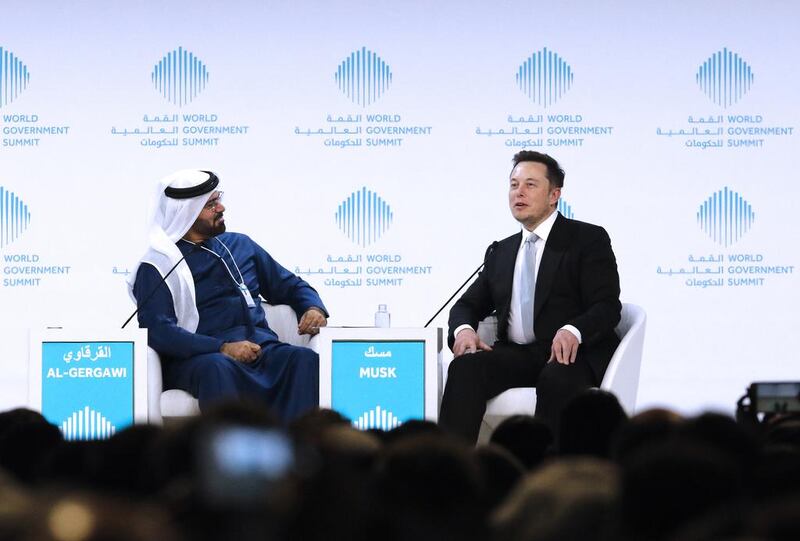 Elon Musk, the co-founder and chief executive of Tesla, speaks as Mohammed Al Gergawi, Minister of Cabinet Affairs, moderates a discussion at the World Government Summit. Jeffrey E Biteng / The National