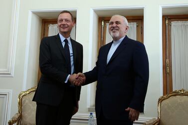 France's top diplomat Emmanuel Bonne shakes hands with Iran's Foreign Minister Mohammad Javad Zarif in Tehran, Iran July 10, 2019. Reuters