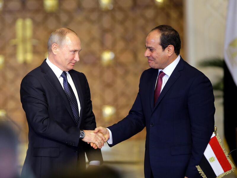 epa06383075 Egyptian President Abdel Fattah al-Sisi (R) and Russian President Vladimir Putin shake hands after a news conference following their talks in Cairo, Egypt, 11 December 2017. Putin arrived in Cairo to discuss with his Egyptian counterpart regional and bilateral issues, including the construction of a nuclear power plant and the resumption of Russian flights to Egypt.  EPA/KHALED ELFIQI