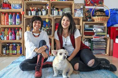 Abu Dhabi, U.A.E., February 2, 2019. Christina (right) and Tanya Awad with their dog Brownie, have brought together hundreds of people since they launched their indie arts and culture initiative, Blank Canvas Community. Victor Besa/The National Section: WK Reporter: Nathalie Farah