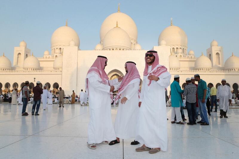 Abu Dhabi, United Arab Emirates, July 17, 2015:    Men from Saudi Arabia greet each other after Eid prayers at Sheikh Zayed Grand Mosque in Abu Dhabi on July 17, 2015. Eid al Fitr marks the end of the holy month of Ramadan. Christopher Pike / The National

Reporter:  N/A
Section: News
Keywords: 

 *** Local Caption ***  CP0717-na-EID PRAYERS15.JPG