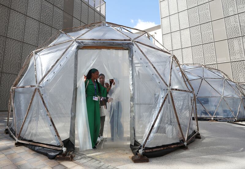 Pollution Pods, an installation by British artist Michael Pinsky, where Cop28 visitors can safely experience the air pollution in Beijing and other cities. Chris Whiteoak / The National