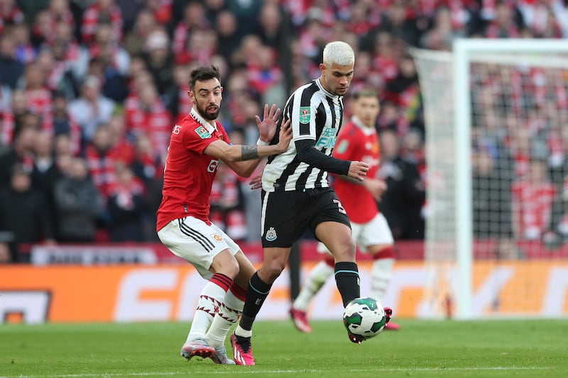Newcastle's Bruno Guimaraes is challenged by Manchester United's Bruno Fernandes. AP 