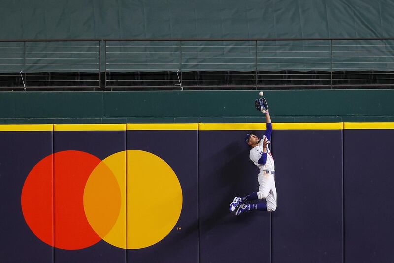 Los Angeles Dodgers' Mookie Betts the catches a fly ball hit by Freddie Freeman of the Atlanta Braves during Game 7 of the MLB National League Championship Series at Globe Life Field in Arlington, Texas, on Sunday, October 18. AFP