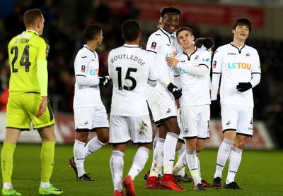 SWANSEA, WALES - FEBRUARY 06:  Tom Carroll of Swansea City celebrates with teammate Tammy Abraham after scoring his sides seventh goal during The Emirates FA Cup Fourth Round match between Swansea City and Notts County at the Liberty Stadium on February 6, 2018 in Swansea, Wales.  (Photo by Catherine Ivill/Getty Images)