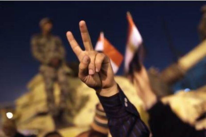 Demonstrators in Tahrir Square cheer after hearing news of the resignation of the Egyptian President Hosni Mubarak on February 11, 2011. Dissent, according to The Princeton Encyclopedia of Islamic Thought, is a primary obligation in the face of an unjust form of government. John Moore / Getty Images