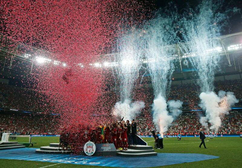 Liverpool players with the trophy after winning the UEFA Super Cup. AP Photo