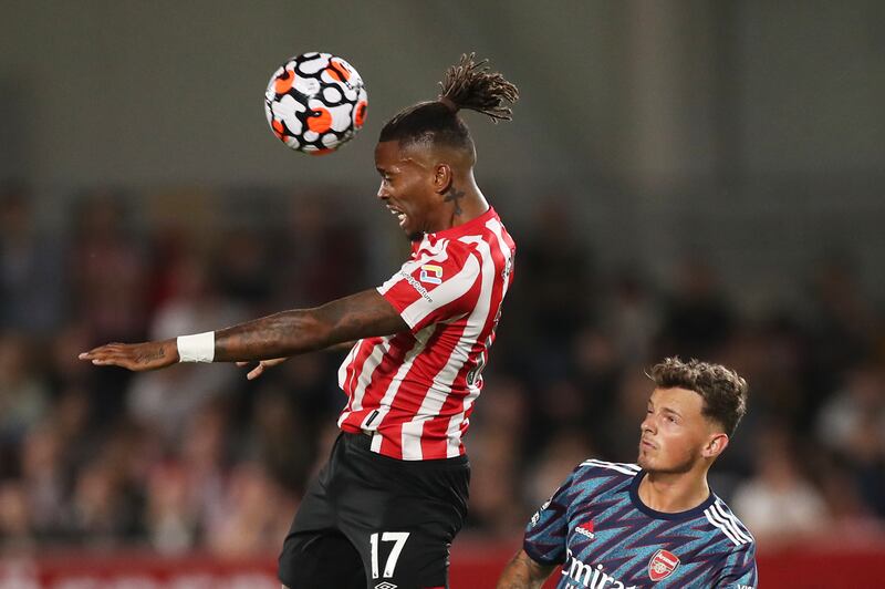 Brentford's Ivan Toney in action with Arsenal's Ben White.