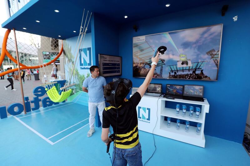 Abu Dhabi, United Arab Emirates - Reporter: Jon Turner: Fans enjoy The Nationals booth during the Mubadala World Tennis Championship. Friday, December 20th, 2019. Zayed Sports City, Abu Dhabi. Chris Whiteoak / The National