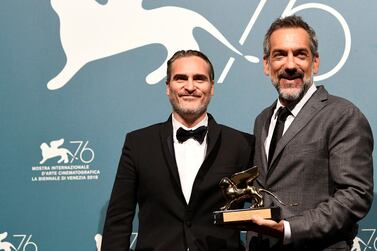 Director Todd Phillips poses next to Joaquin Phoenix with the Golden Lion for Best Film for 'Joker' at the The 76th Venice Film Festival. Reuters 
