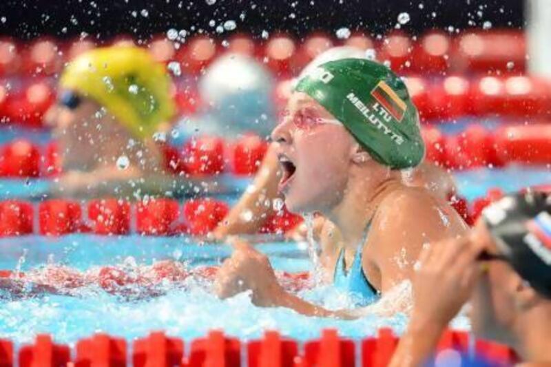 Lithuania's Ruta Meilutyte reacts after breaking the women's 100m breaststroke world record in Barcelona.