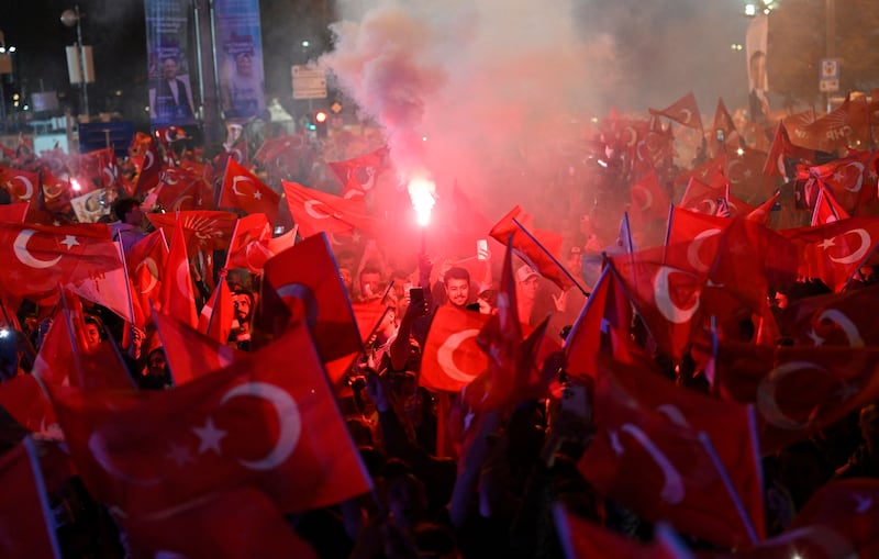 Opposition Republican People's Party supporters celebrate outside the main municipality building following municipal elections across Turkey, in Istanbul. AFP