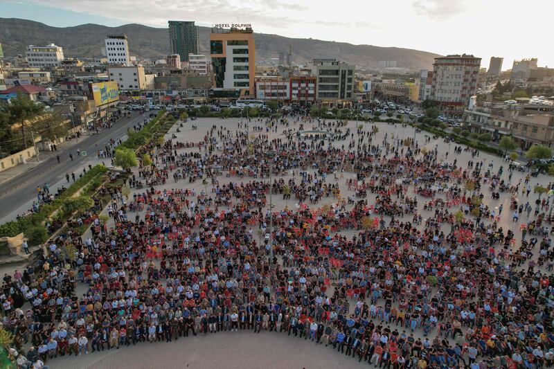 An aerial picture shows Iraqi Kurds gathering in Nowruz Square in the northern city of Dohuk on the eve of celebrations marking the birth of the Prophet Mohammed.