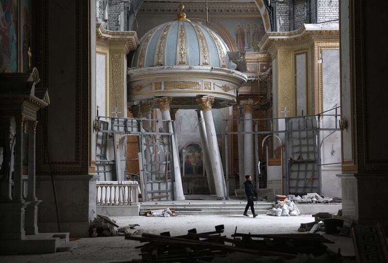 A worker carries out repairs to the Cathedral of the Transfiguration that was damaged as a result of a Russian missile in Odesa. AFP