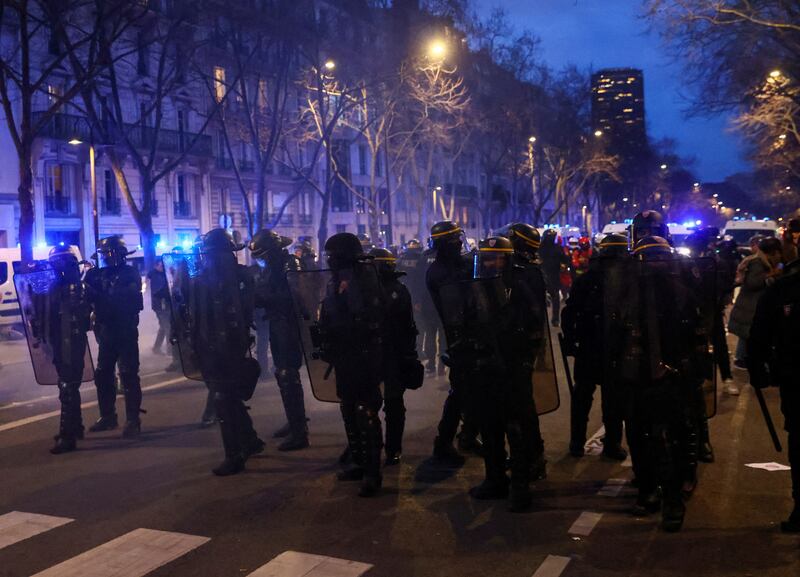 French riot officers stand guard at the Paris protest. Reuters