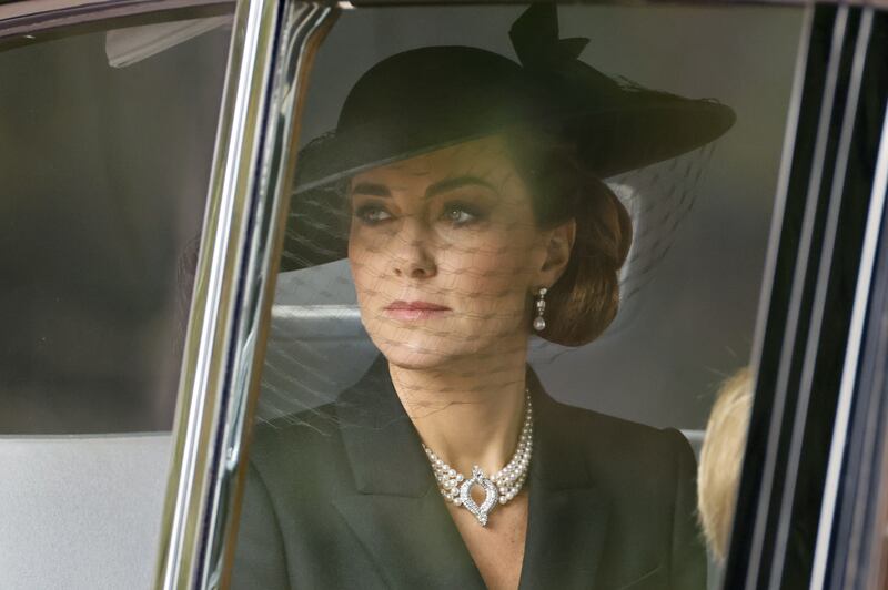 The Princess of Wales pairs the earrings with a four-row pearl choker necklace from the queen's collection, which was a gift from the Japanese government. EPA