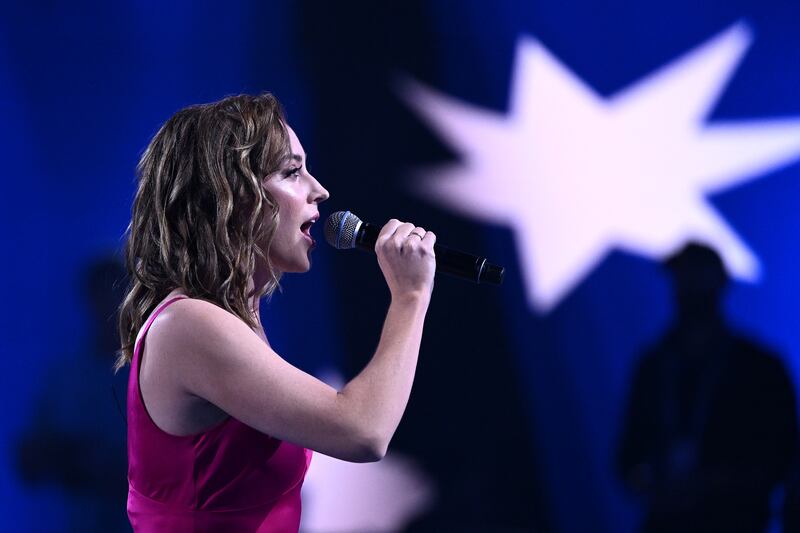 Stefanie Jones sings the national anthem at Melbourne Park. Getty