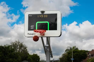 The Huupe is a full-size, smart basketball hoop that uses AI to track performance and play against other players around the world. Photo: Huupe