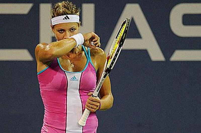 Maria Kirilenko wipes her face between points in her fourth round defeat to Sam Stosur at the US Open.