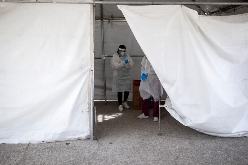 Medical personnel are seen inside a tent after administering free Covid-19 tests at a state run drive-through testing site in the parking lot of the University of Texas El Paso campus in El Paso, Texas, USA. Reuters