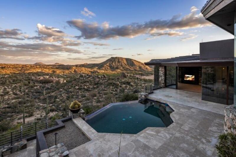 An infinity pool looks out over the valley. Courtesy Engel & Volkers