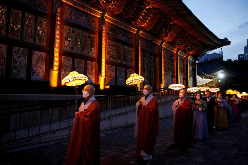 Buddhist monks and believers attend a lantern parade in celebration of the upcoming birthday of Buddha at a temple in Seoul, South Korea. Reuters