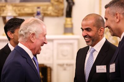 King Charles and Sheikh Hamed bin Zayed, managing director of Abu Dhabi Investment Authority at a reception at Buckingham Palace. PA 