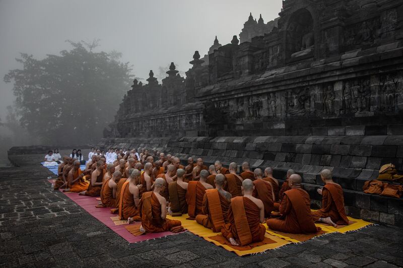 Buddhist monks pray at Borobudur temple during celebrations for Vesak Day on May 18, 2019 in Magelang, Central Java, Indonesia. Getty Images