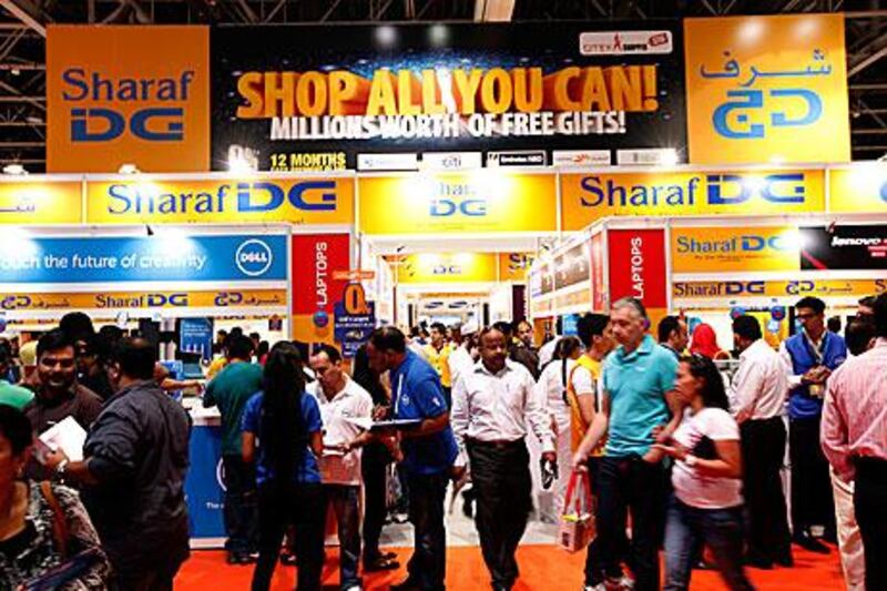 Visitors pour into the Sharaf DG shop at the Dubai World Trade Centre yesterday during the Gitex Shoppers Spring show, where bargains are available on more than 30,000 gadgets and appliances. Satish Kumar / The National