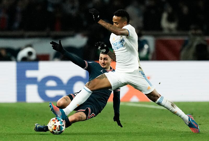 PSG's Marco Verratti, left, slides in on Real Madrid's Eder Militao. AP