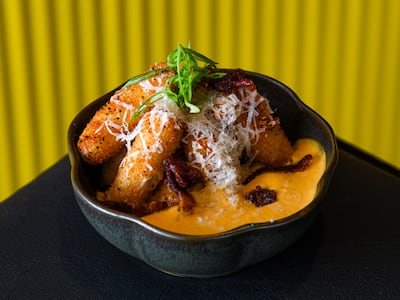 Tteokbokki rice flour cylinders coated in a crunchy outer layer and served in a bowl of silky smooth sauce. Photo: Hoe Lee Kow
