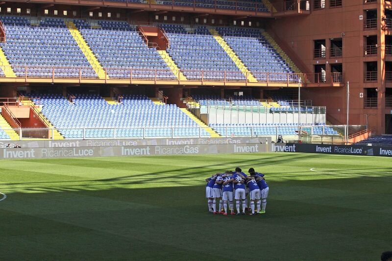Sampdoria players get together in an empty Luigi Ferraris stadium prior to their Serie A match against Verona. AP