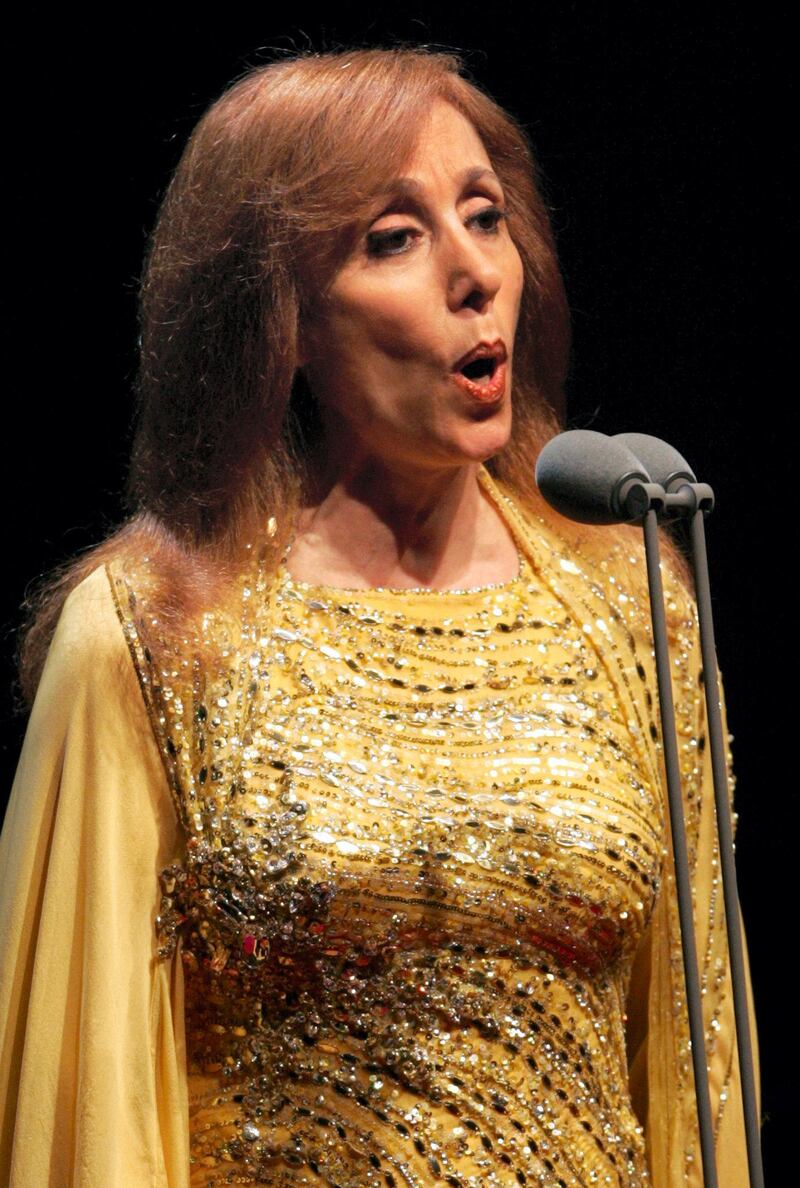 Lebanese diva Fairuz performs at the American University concert hall in Dubai, 30 March 2006. Marking her first concert of the year, the legendary singer was accompanied by her mixed Armenian and Lebanese orchestra, conducted by Karen Durgarian. The concert, Fairuz's first in Gulf since 2003, was held to raise funds for the Gulf emirate's Autism Center. AFP PHOTO/RABIH MOGHRABI / AFP PHOTO / RABIH MOGHRABI