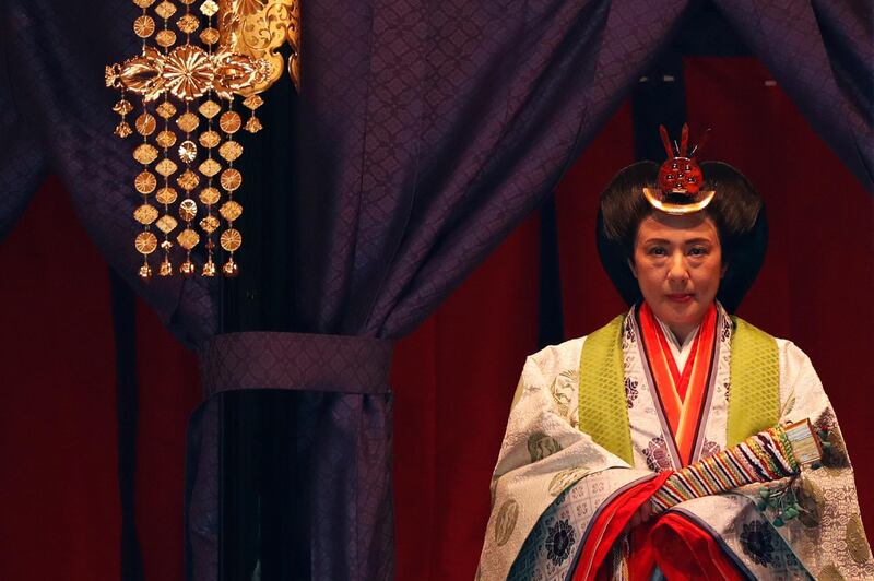 Japan's Empress Masako makes her appearance during a ceremony to proclaim Emperor Naruhito's enthronement to the world.  AP