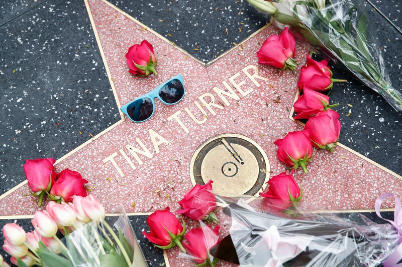 Flowers lie across Turner's Hollywood Walk of Fame Star. EPA