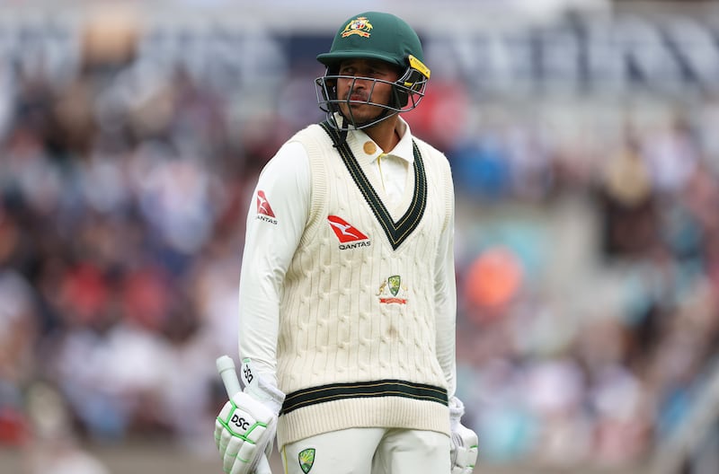 Usman Khawaja of Australia leaves the pitch after being dismissed lbw by Chris Woakes. Getty