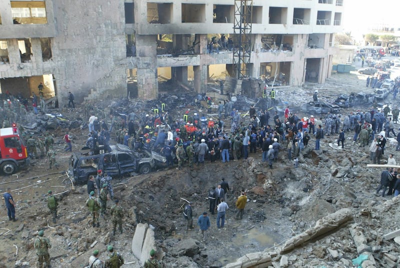 A general view shows the site of an massive explosion in Beirut 14 February 2005. Lebanon's former prime minister Rafiq Hariri was killed in the explosion in central Beirut, hospital sources said. The blast set ablaze cars and devastated buildings in a seafront area of the Lebanese capital on Monday, leaving smouldering bodies in the streets.      AFP PHOTO/ANWAR AMRO (Photo by ANWAR AMRO / AFP)