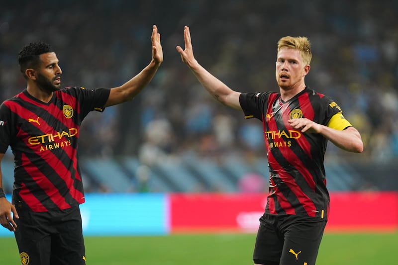 Manchester City's Kevin De Bruyne celebrates scoring their  first goal with teammate Riyad Mahrez. PA