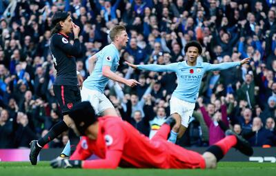 MANCHESTER, ENGLAND - NOVEMBER 05: Kevin De Bruyne of Manchester City celebrates scoring his sides first goal with Leroy Sane of Manchester City during the Premier League match between Manchester City and Arsenal at Etihad Stadium on November 5, 2017 in Manchester, England.  (Photo by Clive Brunskill/Getty Images)