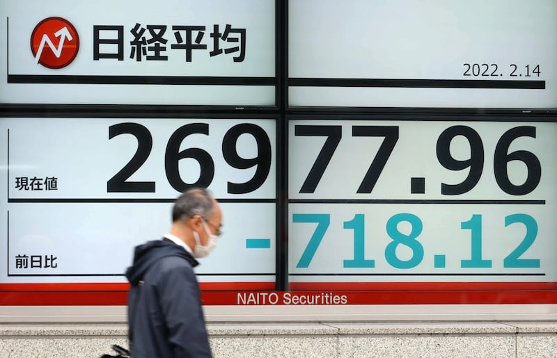 A stock market board in Tokyo. The Nikkei lost more than 0.91 per cent on Tuesday as investors contemplated the implications of a potential Russian invasion of Ukraine. EPA