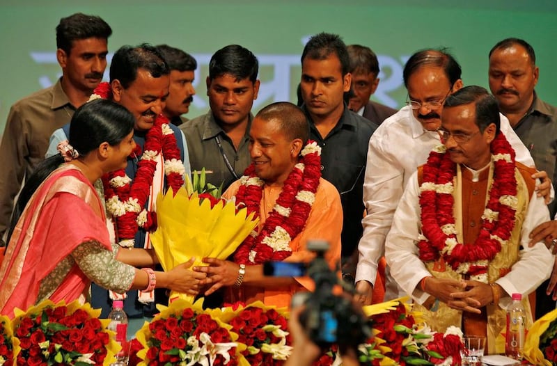 India's ruling Bharatiya Janata Party (BJP) leader Yogi Adityanath, centre, greeted after he was elected as chief minister of India's most populous state of Uttar Pradesh, during the party lawmakers' meeting in Lucknow, India March 18, 2017. Pawan Kumar/Reuters