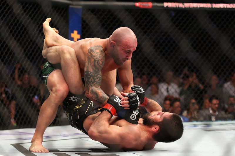 Alex Volkanovski has Islam Makhachev on the canvas during their fight at UFC 284. Getty
