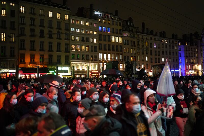 People attend a night light show in Lyon, France, on December 8. AP