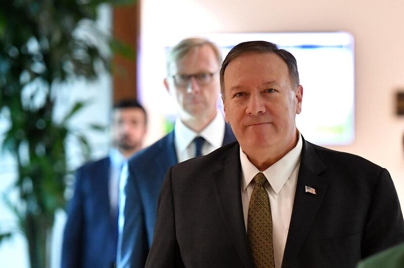US Secretary of State Mike Pompeo and US special representative on Iran Brian Hook (background) arrive to al-Bateen Air Base in Abu Dhabi on September 19, 2019.  / AFP / POOL / MANDEL NGAN
