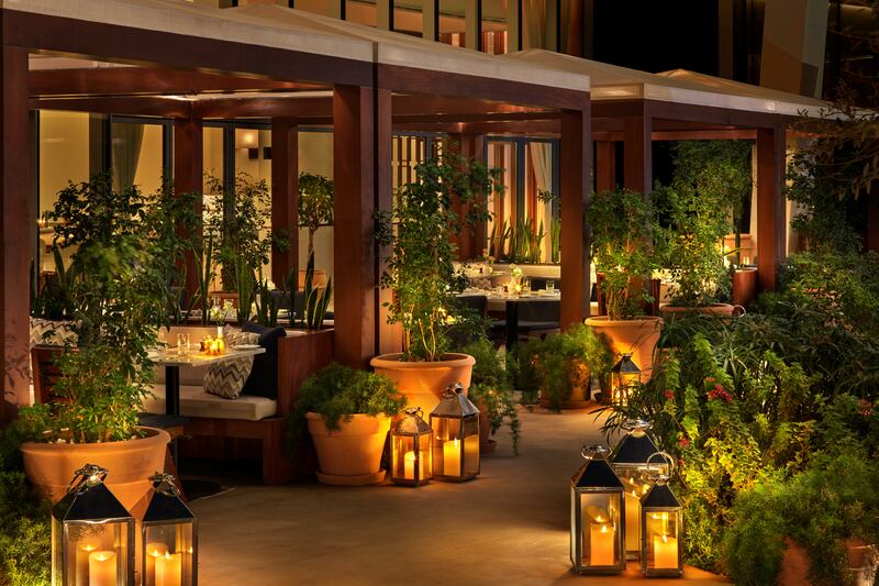 The outdoor seating area is even prettier at night. Photo: Abu Dhabi Edition