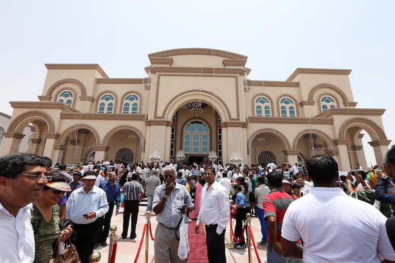 
RAK , UNITED ARAB EMIRATES Ð June 14 , 2013 : People after the first mass at the newly constructed Catholic Church , St . Anthony of Padua in Ras Al Khaimah. ( Pawan Singh / The National ) For News. Story by Afshan *** Local Caption ***  PS1406- RAK CHURCH02.jpg