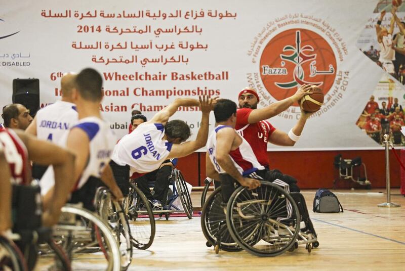 The UAE's men's wheelchair basketball team in action against Jordan at Al Ahli Sports Club in Dubai. Lee Hoagland / The National