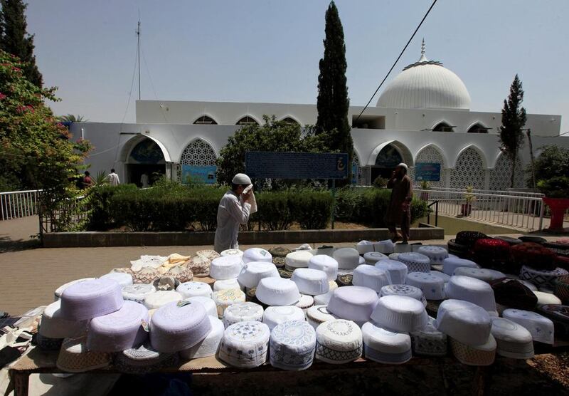 A boy wipes his face as he arrives to attend the first Friday prayers of the holy month of Ramadan at a mosque in Islamabad, Pakistan. Faisal Mahmood / Reuters